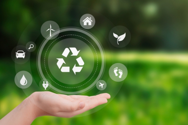 hand with recycling and eco symbols depicting sustainability and energy efficiency