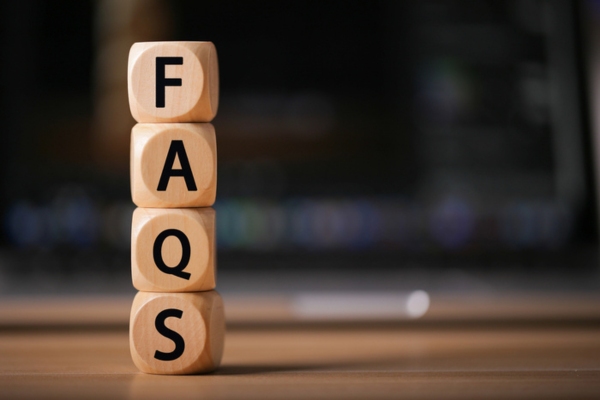 FAQS spelled vertically with wooden blocks depicting frequently asked questions