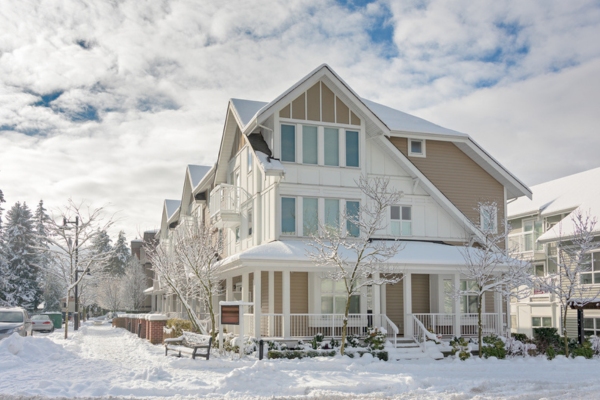 Street of residential townhouses during winter