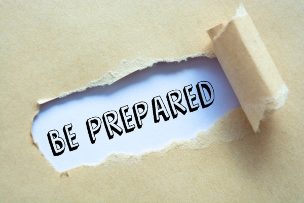 Text Be Prepared appearing behind ripped brown paper depicting emergency planning and preparedness