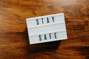 'Stay safe' text in light box on wooden background depicting propane use