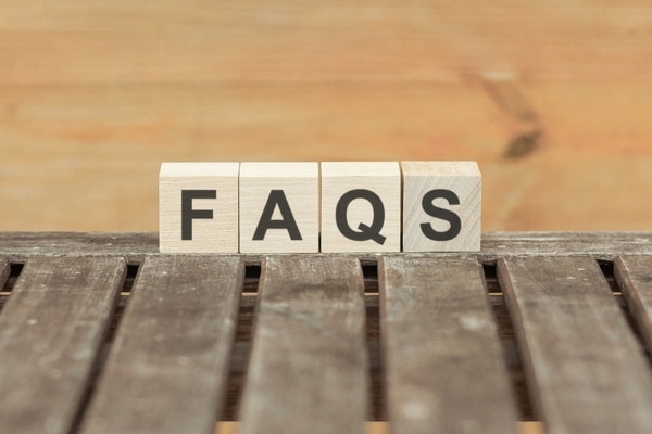 FAQS spelled using wooden letter chips depicting questions about propane and electric heat pumps