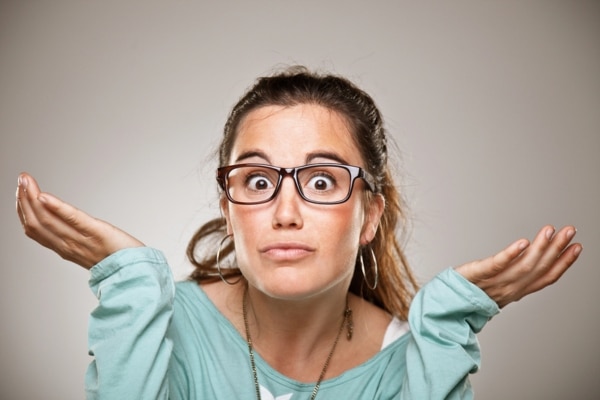 woman with both hands raised on the side depicting asking what a propane tank regulator is